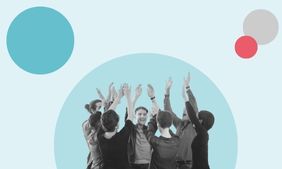 Group of people collaborating excitedly in a circle